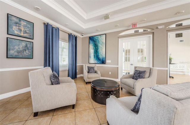 14008 Lugano Ct, Hudson, FL 34669 - living area with light tile patterned flooring, baseboards, a tray ceiling, french doors, and ornamental molding