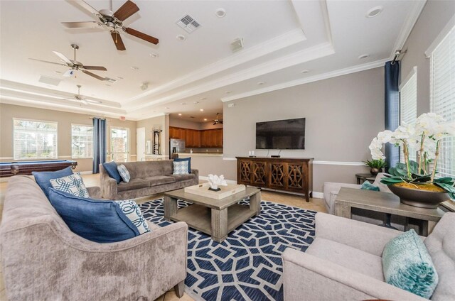 14008 Lugano Ct, Hudson, FL 34669 - living room with a tray ceiling, a ceiling fan, billiards table, baseboards, and crown molding