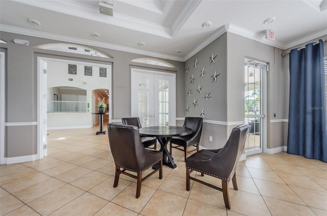 14008 Lugano Ct, Hudson, FL 34669 - dining room featuring light tile patterned flooring, ornamental molding, baseboards, and french doors