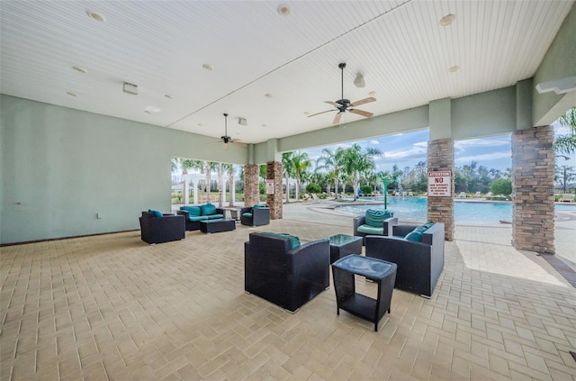 14008 Lugano Ct, Hudson, FL 34669 - view of patio with an outdoor living space, ceiling fan, and a community pool