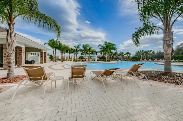 14008 Lugano Ct, Hudson, FL 34669 - community pool with a patio area
