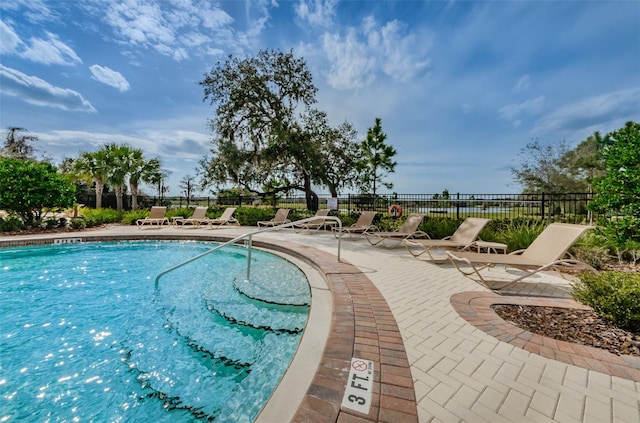 14008 Lugano Ct, Hudson, FL 34669 - community pool featuring a patio