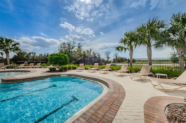 14008 Lugano Ct, Hudson, FL 34669 - community pool with a patio area