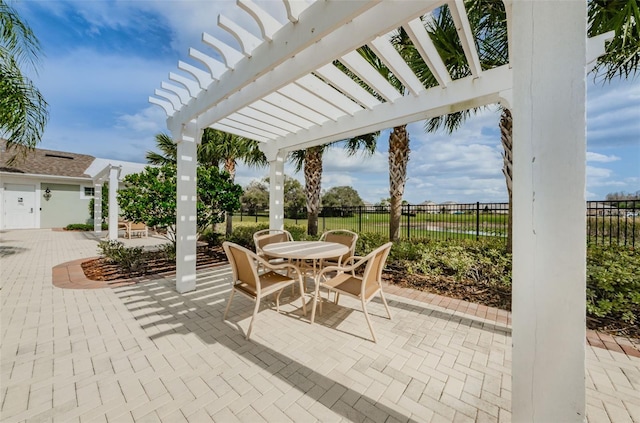 14008 Lugano Ct, Hudson, FL 34669 - view of patio / terrace with a pergola and outdoor dining space