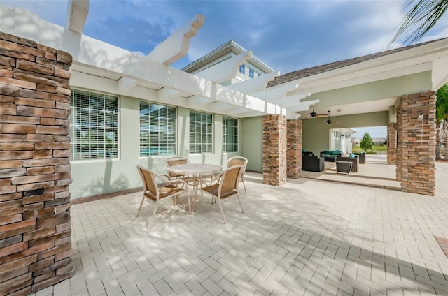 14008 Lugano Ct, Hudson, FL 34669 - view of patio / terrace with a ceiling fan, an outdoor living space, and outdoor dining area