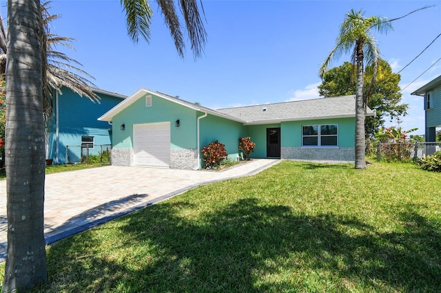 4482 Kingston Dr, Hernando Beach, FL 34607 - ranch-style home with a garage, stucco siding, and decorative driveway