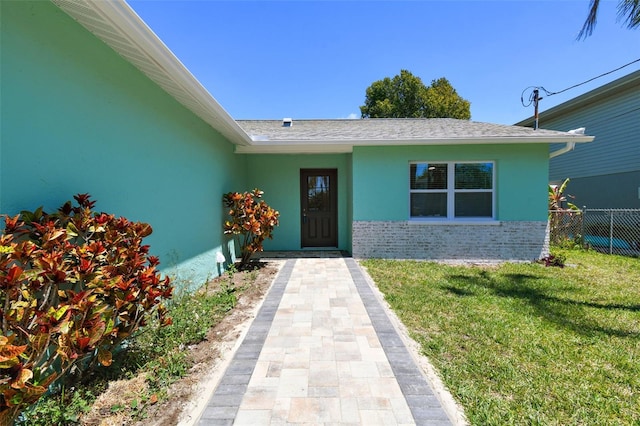 4482 Kingston Dr, Hernando Beach, FL 34607 - doorway to property featuring stucco siding and brick siding