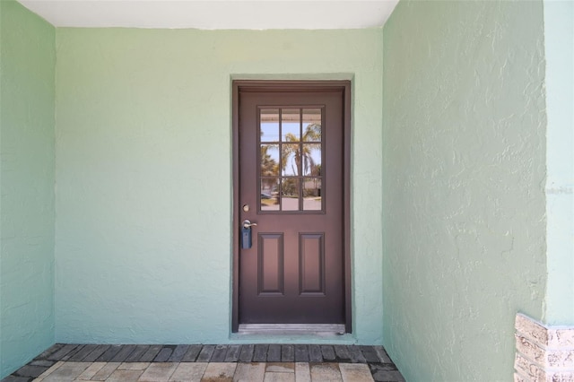 4482 Kingston Dr, Hernando Beach, FL 34607 - view of exterior entry featuring stucco siding