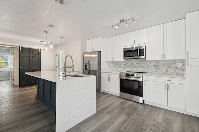 4482 Kingston Dr, Hernando Beach, FL 34607 - kitchen featuring stainless steel appliances, a sink, dark wood-style flooring, and backsplash