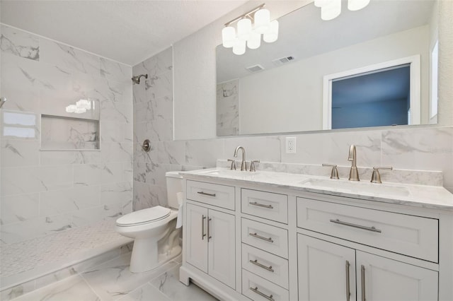 4482 Kingston Dr, Hernando Beach, FL 34607 - full bathroom with marble finish flooring, double vanity, toilet, a marble finish shower, and tile walls