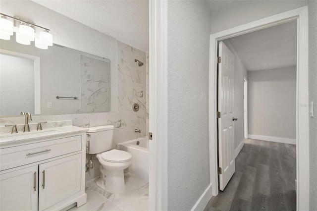 4482 Kingston Dr, Hernando Beach, FL 34607 - bathroom featuring vanity, toilet, shower / bath combination, a textured wall, and wood finished floors