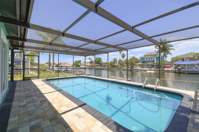 4482 Kingston Dr, Hernando Beach, FL 34607 - swimming pool with a water view, a lanai, and a patio area