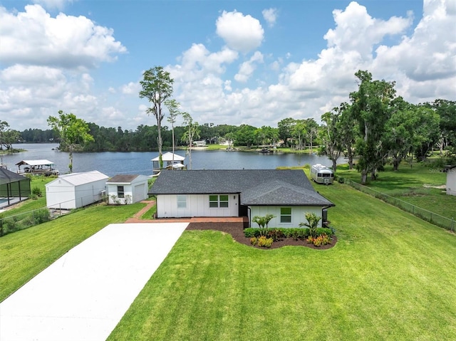 18102 Spencer Rd, Odessa, FL 33556 - ranch-style home with a water view, driveway, and roof with shingles