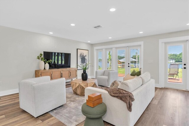 18102 Spencer Rd, Odessa, FL 33556 - living area featuring light wood finished floors, recessed lighting, and baseboards