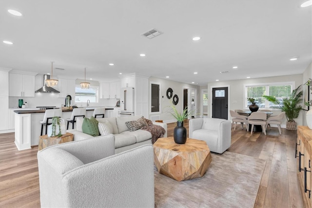 18102 Spencer Rd, Odessa, FL 33556 - living area featuring light wood-type flooring and recessed lighting