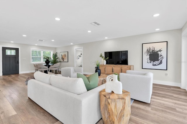 18102 Spencer Rd, Odessa, FL 33556 - living room featuring light wood-type flooring, recessed lighting, and baseboards