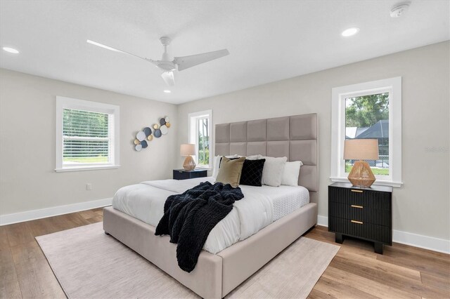 18102 Spencer Rd, Odessa, FL 33556 - bedroom with wood finished floors, baseboards, recessed lighting, and a ceiling fan