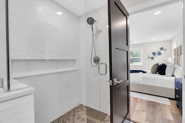 18102 Spencer Rd, Odessa, FL 33556 - ensuite bathroom featuring a stall shower and wood finished floors