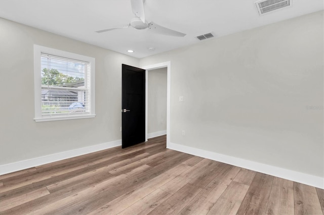 18102 Spencer Rd, Odessa, FL 33556 - spare room with wood finished floors, baseboards, a ceiling fan, and recessed lighting