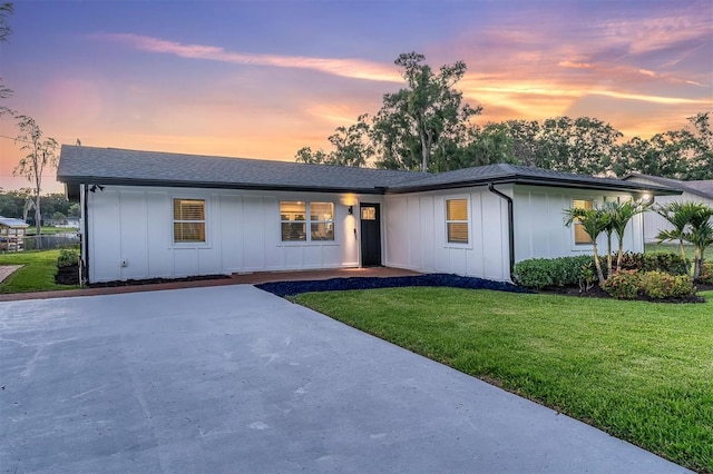 18102 Spencer Rd, Odessa, FL 33556 - ranch-style house with board and batten siding and a front lawn