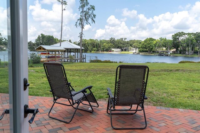 18102 Spencer Rd, Odessa, FL 33556 - view of patio featuring a gazebo, a water view, and view of wooded area