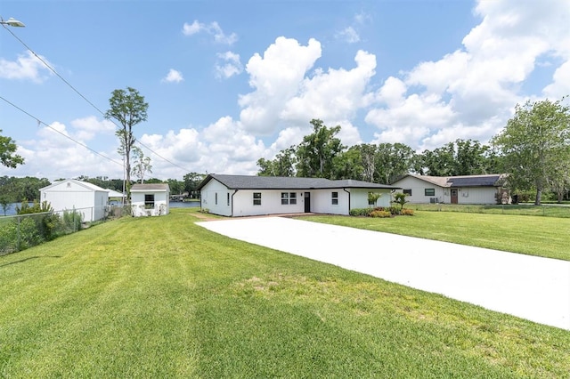 18102 Spencer Rd, Odessa, FL 33556 - rear view of house featuring driveway
