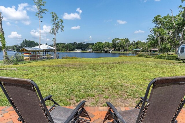 18102 Spencer Rd, Odessa, FL 33556 - view of green lawn with a gazebo and a water view