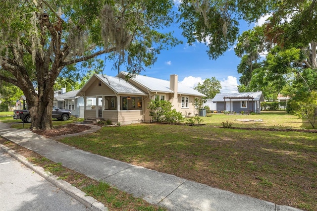 6207 Main St, New Port Richey, FL 34653 - single story home featuring a chimney, a front yard, a garage, and central AC unit