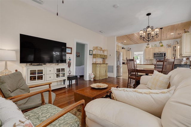 6207 Main St, New Port Richey, FL 34653 - living room featuring a chandelier and wood finished floors