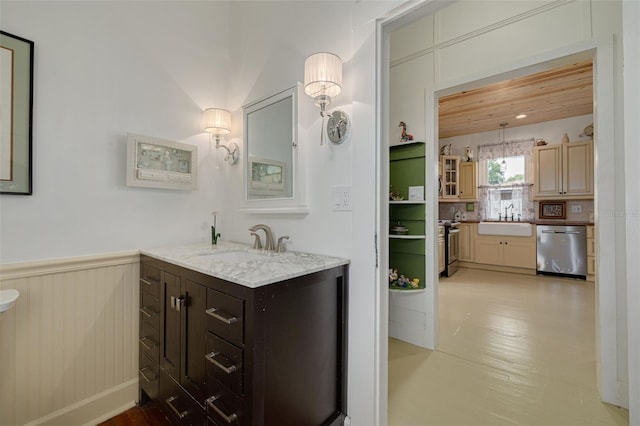 6207 Main St, New Port Richey, FL 34653 - bathroom with vanity and a wainscoted wall