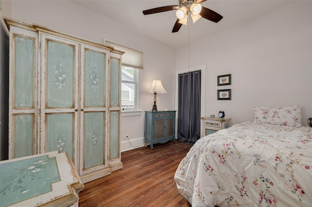 6207 Main St, New Port Richey, FL 34653 - bedroom with wood finished floors, baseboards, and a ceiling fan
