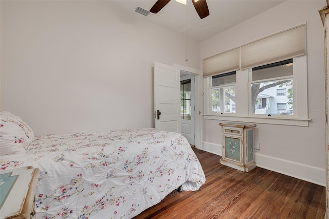 6207 Main St, New Port Richey, FL 34653 - bedroom featuring wood finished floors, baseboards, and a ceiling fan