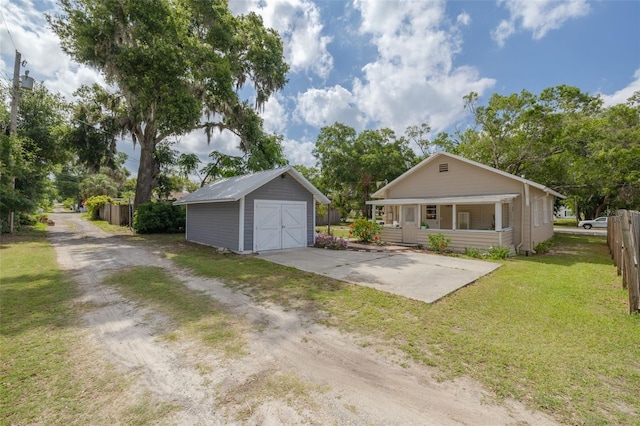 6207 Main St, New Port Richey, FL 34653 - view of front facade with a garage, a porch, and driveway