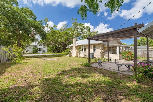 6207 Main St, New Port Richey, FL 34653 - view of yard featuring a pergola and a patio