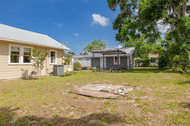 6207 Main St, New Port Richey, FL 34653 - view of yard featuring a pergola and central AC unit