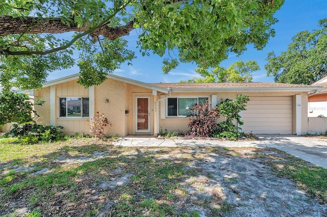 4025 Stratfield Dr, New Port Richey, FL 34652 - ranch-style house featuring an attached garage, stucco siding, and driveway
