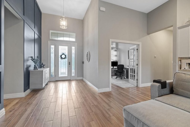 16697 Courtyard Loop, Land O Lakes, FL 34638 - foyer with a towering ceiling and light wood-style floors