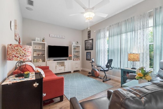 16697 Courtyard Loop, Land O Lakes, FL 34638 - living room featuring a ceiling fan and wood finished floors