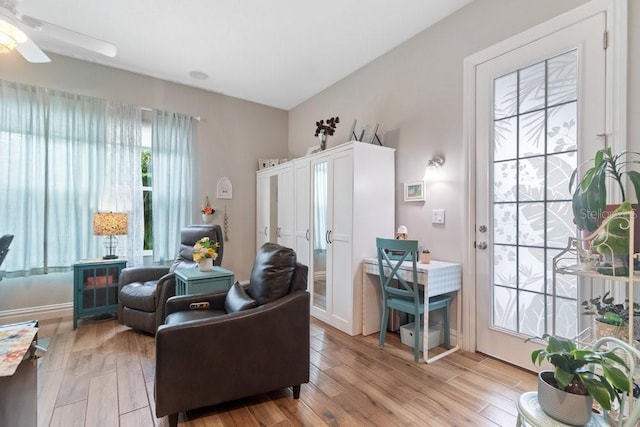 16697 Courtyard Loop, Land O Lakes, FL 34638 - living room with ceiling fan and light wood-style floors