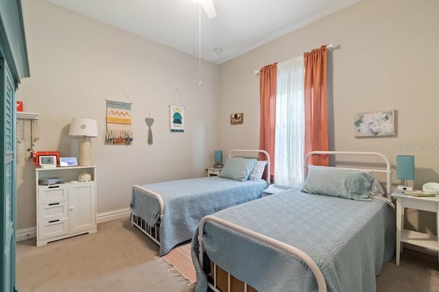 16697 Courtyard Loop, Land O Lakes, FL 34638 - bedroom with light carpet and a ceiling fan