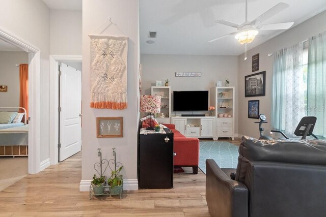 16697 Courtyard Loop, Land O Lakes, FL 34638 - living room featuring light wood-type flooring and a ceiling fan