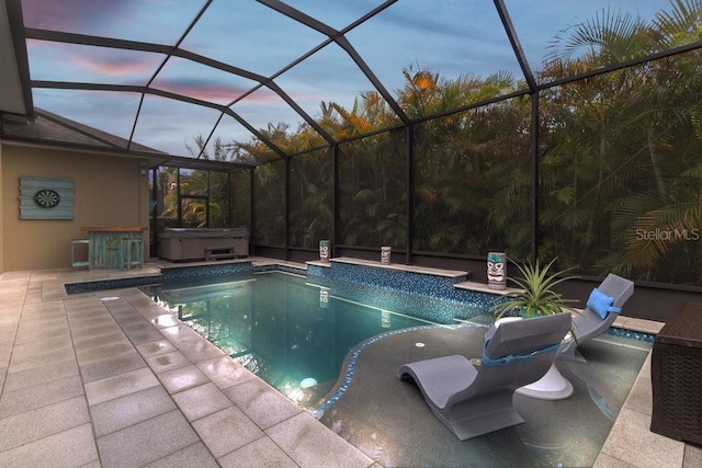 16697 Courtyard Loop, Land O Lakes, FL 34638 - outdoor pool featuring a hot tub, a patio, and a lanai