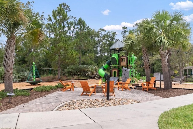 16697 Courtyard Loop, Land O Lakes, FL 34638 - community jungle gym featuring a fire pit and a patio