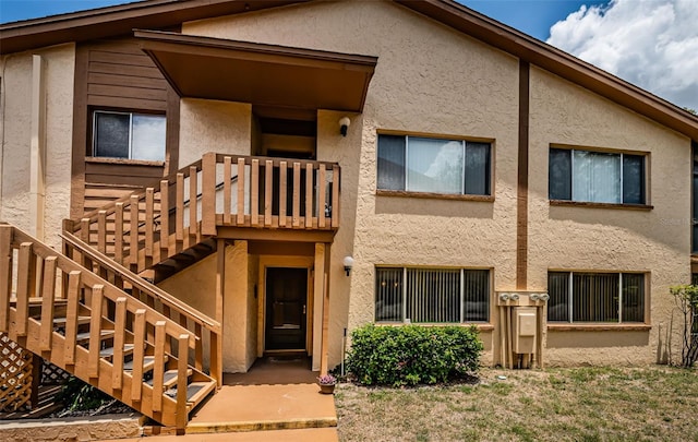 3838 Lanyard Ct Unit B, New Port Richey, FL 34652 - view of front of home with stucco siding and stairway