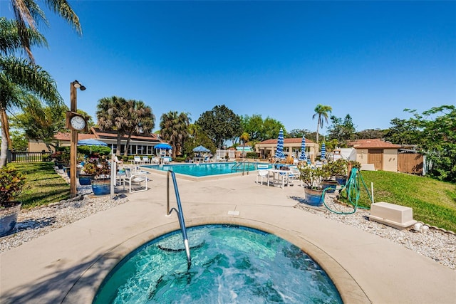 3838 Lanyard Ct Unit B, New Port Richey, FL 34652 - community pool with a hot tub and a patio