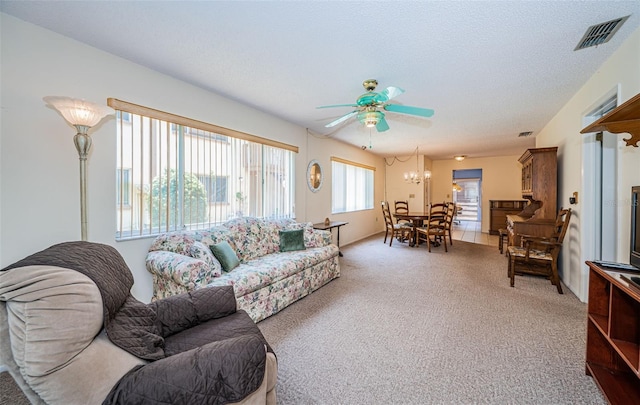 3838 Lanyard Ct Unit B, New Port Richey, FL 34652 - living area featuring a ceiling fan, light carpet, and a chandelier