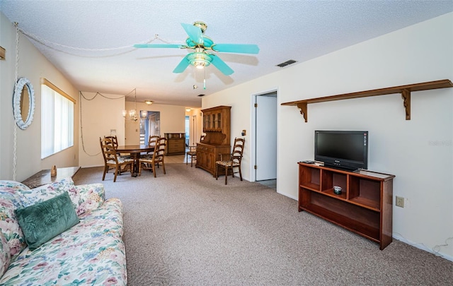 3838 Lanyard Ct Unit B, New Port Richey, FL 34652 - carpeted living area featuring a ceiling fan and a textured ceiling
