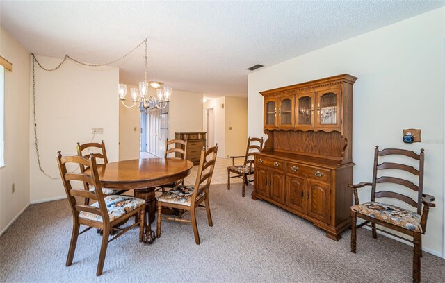 3838 Lanyard Ct Unit B, New Port Richey, FL 34652 - dining space featuring a chandelier, light colored carpet, and baseboards
