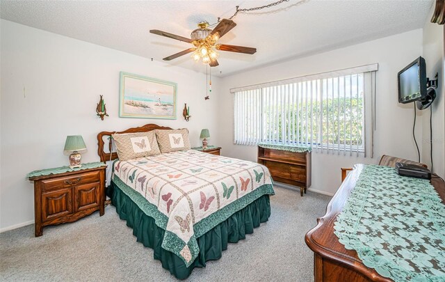 3838 Lanyard Ct Unit B, New Port Richey, FL 34652 - bedroom with light colored carpet, baseboards, and a ceiling fan
