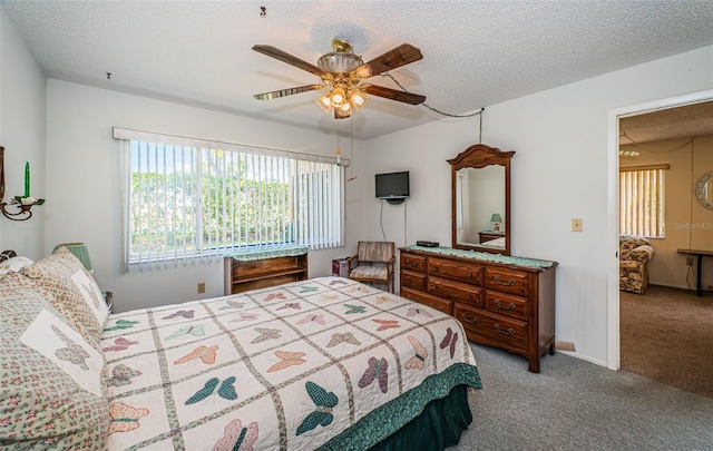 3838 Lanyard Ct Unit B, New Port Richey, FL 34652 - bedroom with light colored carpet, a textured ceiling, a ceiling fan, and baseboards